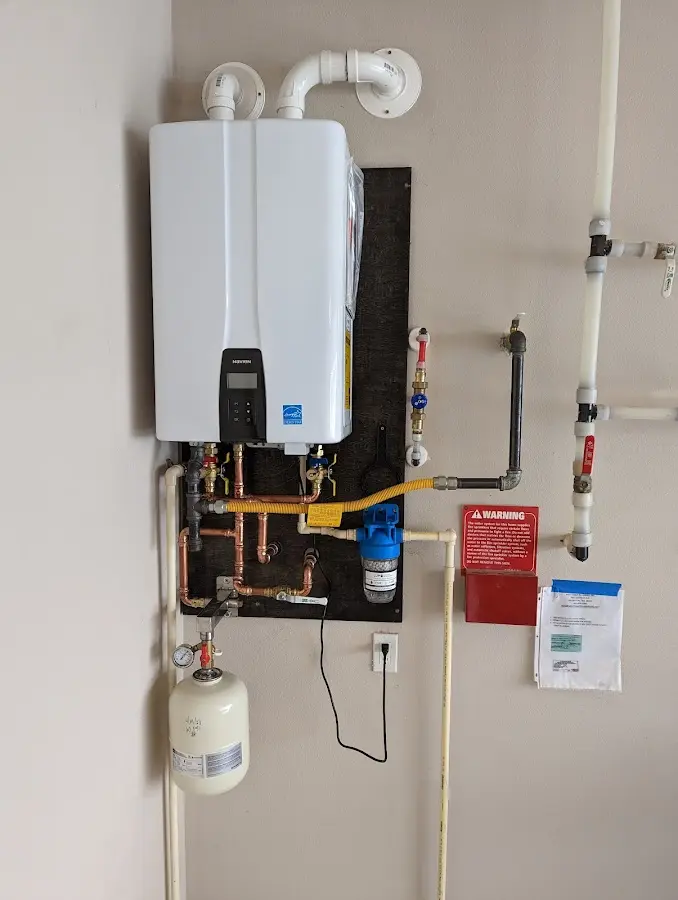 Professional plumber installing copper piping in a Sherman home